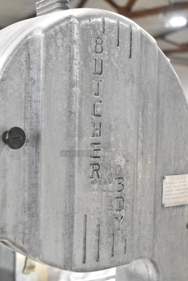 Butcher Boy B12-F metal commercial meat saw, floor style, 115 volts, 1 phase. Visible brand marking, solid condition.