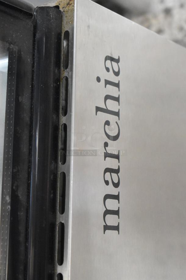 Marchia MB48 stainless steel deli display case corner, logo visible, sleek design with commercial casters for mobility.