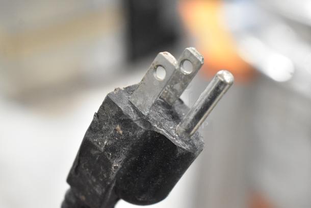 Close-up of a standard 3-prong electrical plug for the Marchia MB48 deli display case.