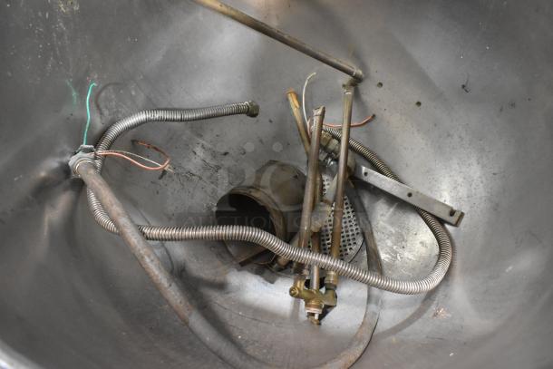 Groen AH/1E stainless steel 80-gallon steam kettle interior view, showing pipes and fittings, in fair condition.