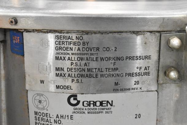 Stainless steel label on a Groen AH/1E steam kettle, showing certifications and specifications for pressure and temperature.