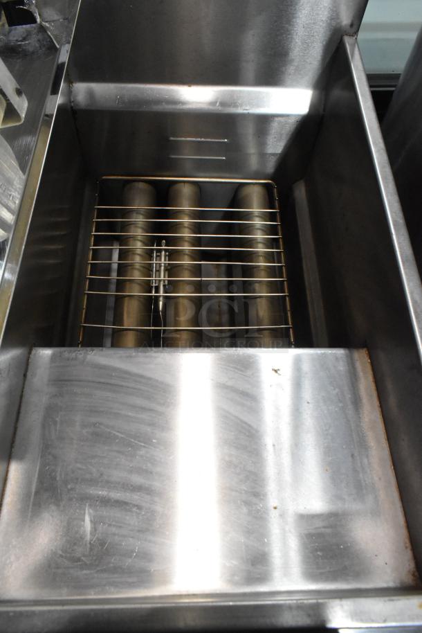 Stainless steel deep fat fryer, model KUT50FRN50SNG, with 2 metal fry baskets; natural gas powered, commercial grade.
