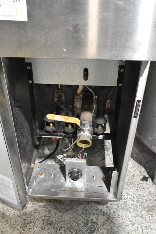 KUT50FRN50SNG stainless steel natural gas deep fat fryer, shows interior valves and wiring, includes two metal fry baskets.