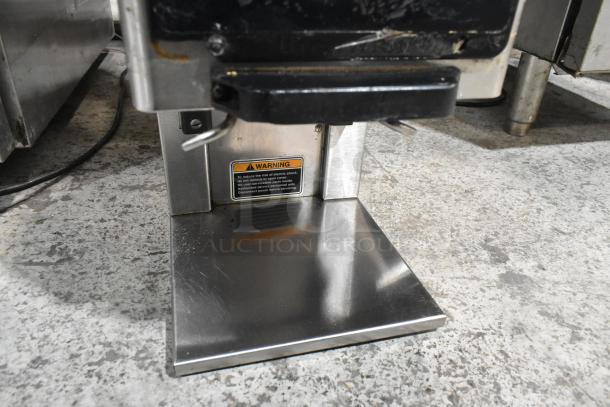 Bunn MHG stainless steel 2-hopper coffee bean grinder, 120V, with warning label on base. Used commercial condition.