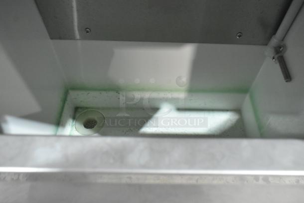 Vevor SZB-20 stainless steel commercial countertop flake ice maker interior view. Condition shows mild wear, 110V, 1 phase.