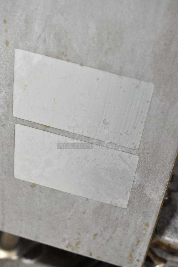 Royal stainless steel commercial deep fat fryer, includes two metal fry baskets, on commercial casters. Visible wear.