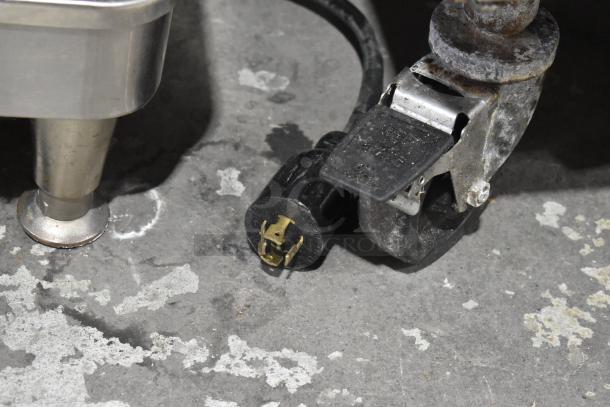 Plug and caster wheel detail of 2020 Bunn ICB SH commercial coffee machine. Stainless steel design, used condition.