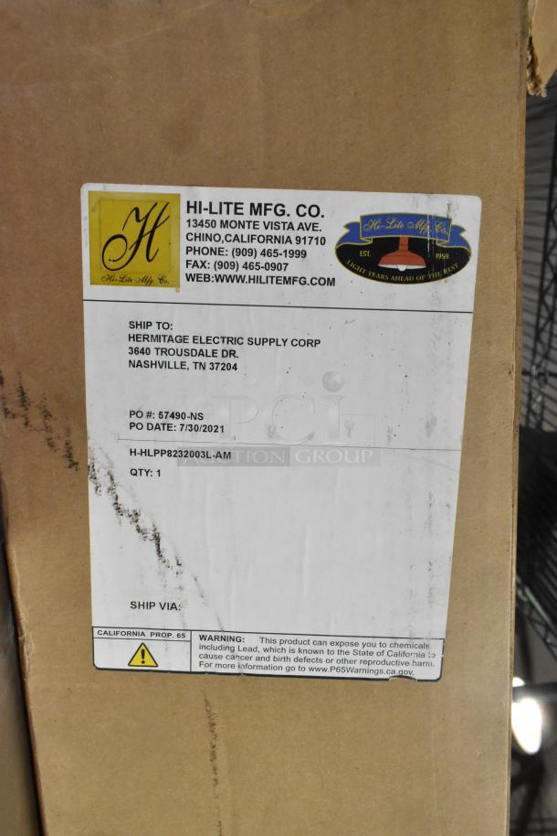 Box with label from Hi-Lite MFG Co., scratched, for a metal orange piece, shipped to Hermitage Electric, PO dated 7/30/2021.