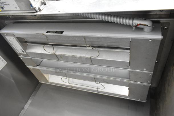 Hatco GRAH-24D metal food warmer in good condition. 120 Volts, 1 Phase. Features caution label and metal housing.