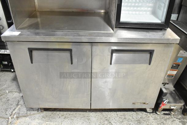 True TUC-48 stainless steel 2-door undercounter cooler on casters, 115V, 1 phase, with visible use marks.