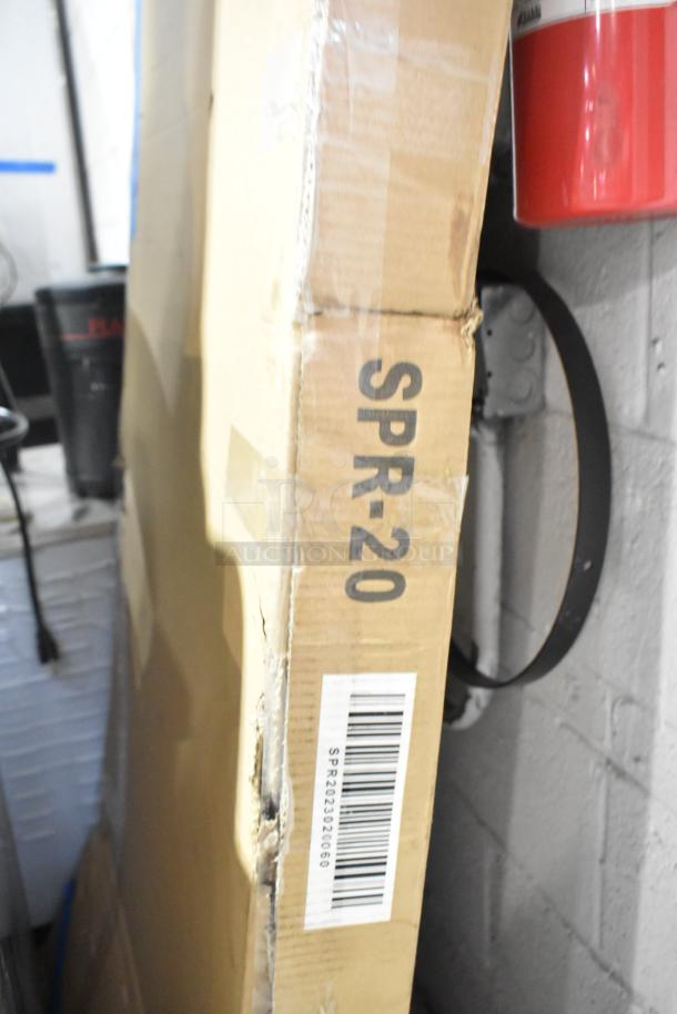 Brand new Prepline SPR-20 20-tier aluminum rack in packaging. Scratch and dent condition. Model SPR-20 labeled on box.