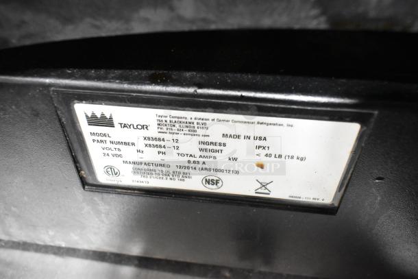 Taylor X83684-12 stainless steel commercial countertop drink blending machine, 115 volts, 1 phase, model label shown.