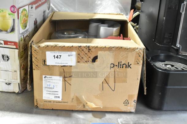 Robot Coupe R2N Food Processor, metal, includes bowl, lid, feed head, grater and slicer blades, 120V, in a marked box.