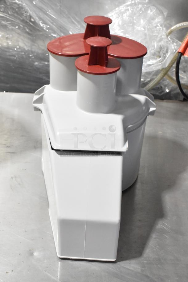 Robot Coupe R2N commercial food processor, white base, red feed head, with bowl, lid, grater and slicing blades, 120V.