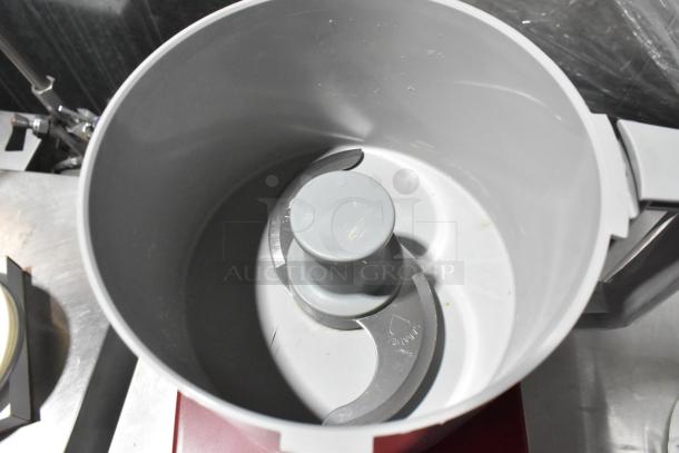 Robot Coupe R2N metal food processor with bowl and lid, slicing blade visible, countertop design, 120V, 1 phase.