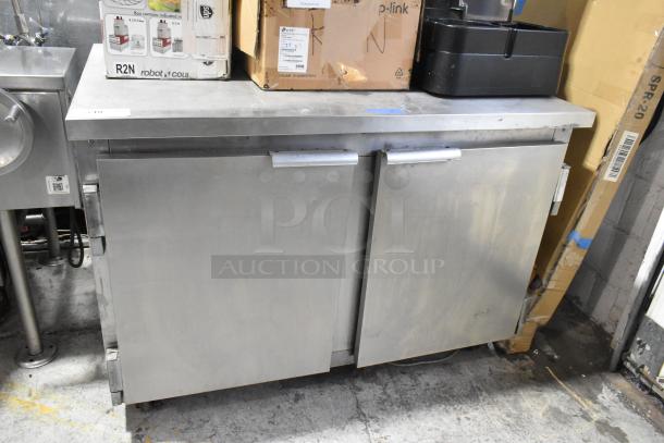 Leader NSFB 48 S/C stainless steel 2-door undercounter cooler on casters. 115V, single phase. Good condition, minor wear.