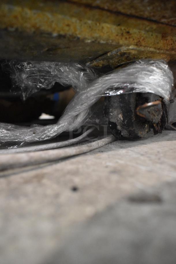 Leader NSFB 48 S/C undercounter cooler caster wrapped in plastic, showing wear; stainless steel finish, 115V, 1 Phase.