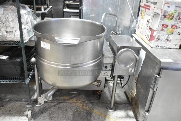 Cleveland stainless steel commercial tilting kettle, floor style, in good condition, with control panel and visible brand label.