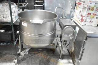 Cleveland stainless steel commercial tilting kettle, floor style, in good condition, with control panel and visible brand label.