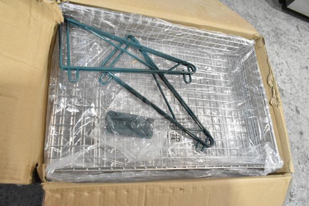 Box containing chrome finish wire baskets, new but labeled with scratch and dent condition. Includes mounting brackets.