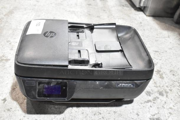 HP OfficeJet 3830 multifunction printer, scanner, copier, and fax machine. Visible wear, includes control panel and labels.