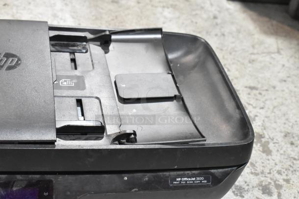 HP OfficeJet 3830 multifunction printer, fax, scanner, and copier. Black, with paper handling tray. Lightly used condition.