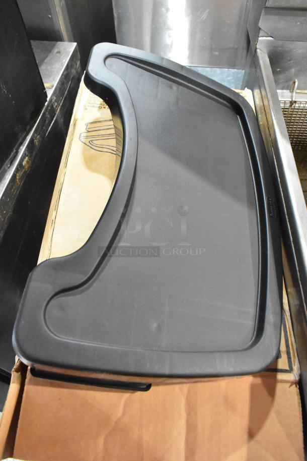 Brand new Rubbermaid FG781588 black high chair tray, sleek design, durable plastic, with easy-to-clean surface.