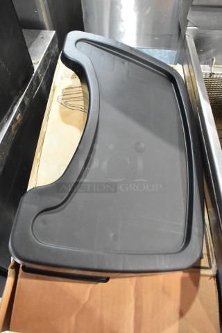 Brand new Rubbermaid FG781588 black high chair tray, sleek design, durable plastic, with easy-to-clean surface.