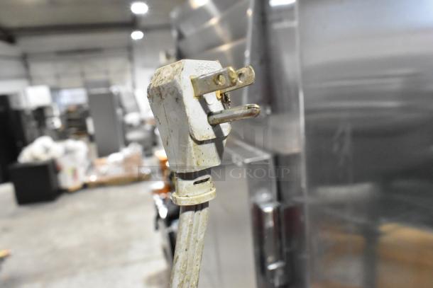 Stainless steel countertop electric deep fat fryer with 115 volts, 1 phase. Appears slightly worn, cord plug visible.