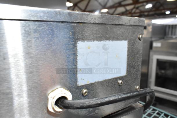 Stainless steel countertop electric deep fryer, 115 volts, 1 phase. Visible wear, no legible labels or markings.