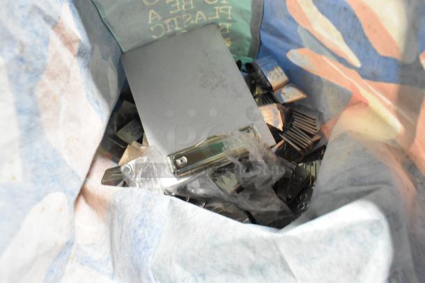 Lot of items in a bag including metal number signs and a standing clipboard menu holder; mixed condition.