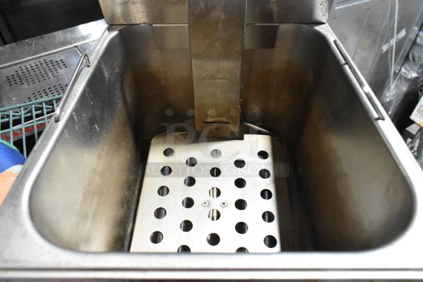 Winco stainless steel countertop electric deep fat fryer, includes metal fry basket, 115 volts, 1 phase.