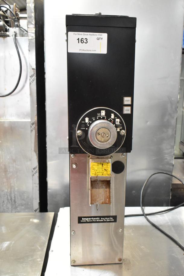 Grindmaster 890-B-T commercial coffee grinder, metal, 115V, with dial settings. Shows some wear. Model label visible.