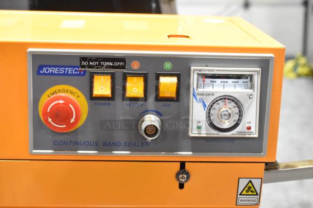 2017 Jorestech CBS-630 metal countertop band sealer with emergency stop, power, heater, fan controls, and temperature gauge.