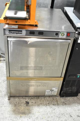 2016 Champion UH130B stainless steel undercounter dishwasher, commercial grade, visible wear. Voltage: 120-208/230, 1 phase.