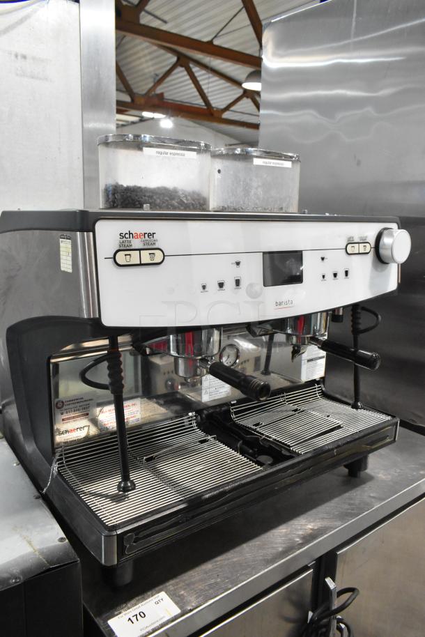 Schaerer Barista stainless steel 2 group espresso machine with 2 portafilters, 2 steam wands, 208/240V, 1 phase, countertop model.