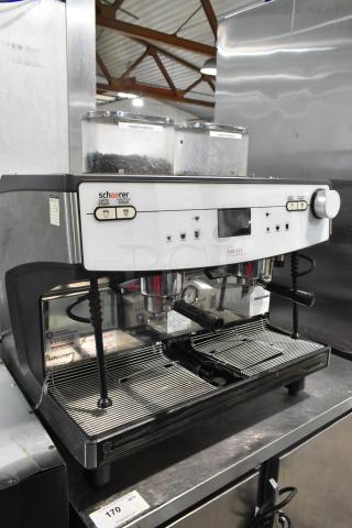 Schaerer Barista stainless steel 2 group espresso machine with 2 portafilters, 2 steam wands, 208/240V, 1 phase, countertop model.