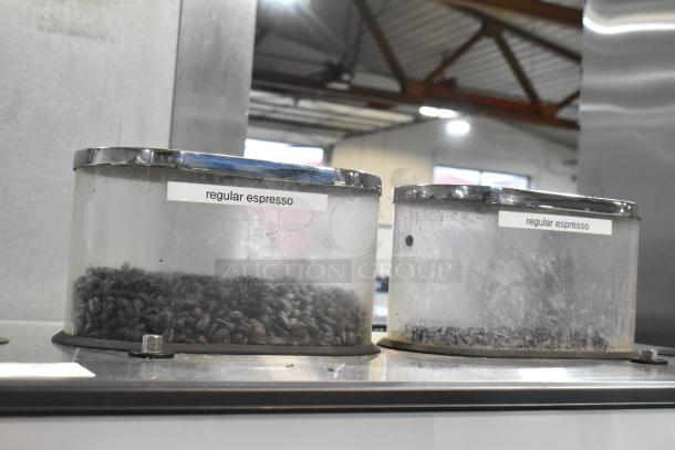 Schaerer Barista espresso machine with 2 group heads, 2 portafilters, and 2 steam wands. Stainless steel finish.