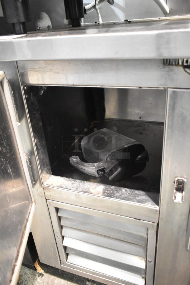Universal Coolers 2-Door Undercounter Cooler, stainless steel, 115V, 1 phase. Shows inside view with minor wear.