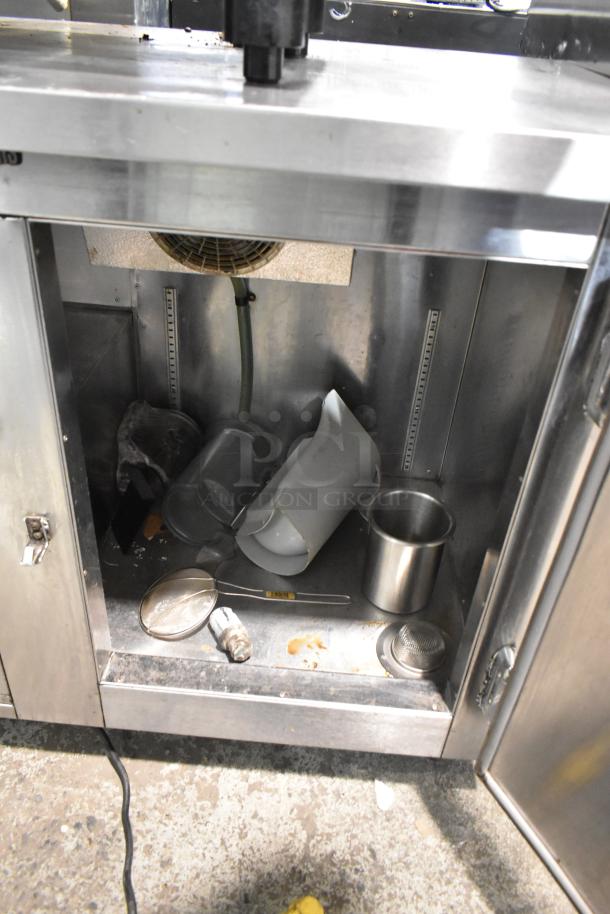 Universal Coolers Stainless Steel 2 Door Undercounter Cooler, 115 Volts, 1 Phase, commercial use, visible interior condition.