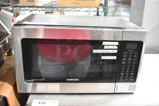 Samsung MG11H2020CT countertop microwave oven with plate. Features include instant cook settings and ceramic interior. Operational condition.