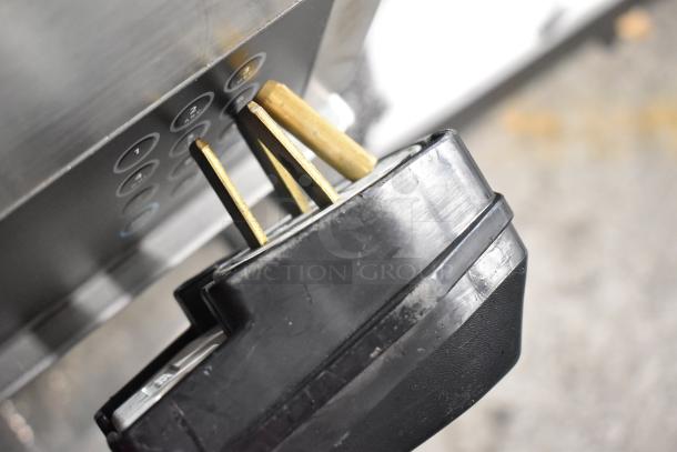 Stainless steel Turbochef I5-DL rapid cook oven plug, close-up. Features 208/240 volts, suitable for 1/3 phase.