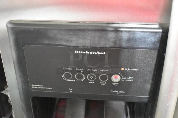 KitchenAid KSRP22FSSS01 stainless steel cooler with freezer, features ice and water dispenser, AquaSense filtration.