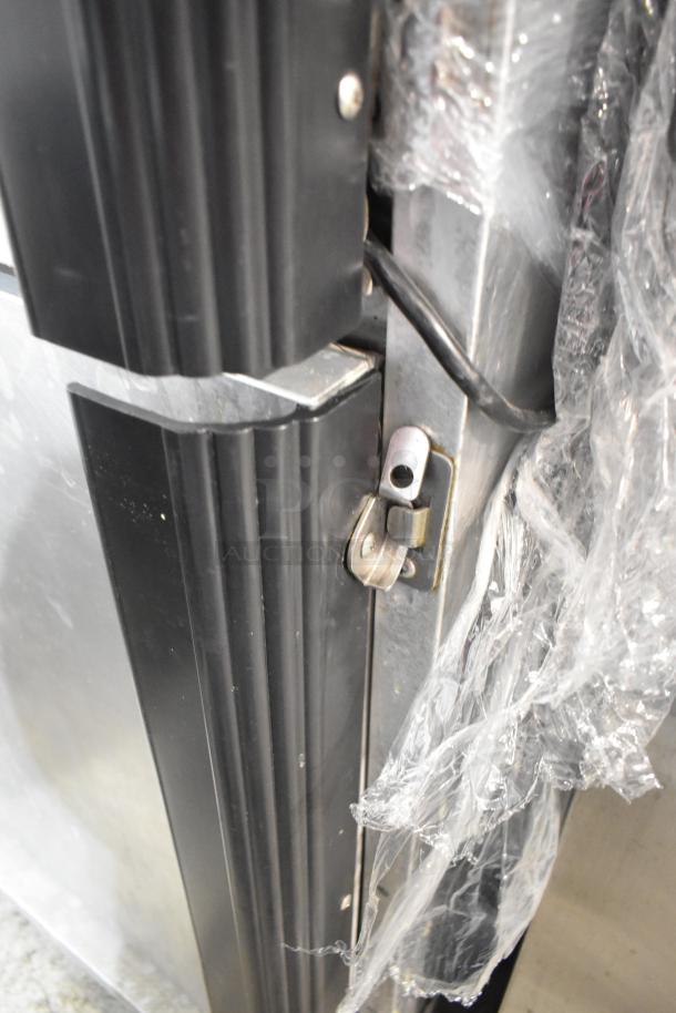 CresCor H137UA12D heated holding cabinet, metal construction, commercial casters, 115 volts, 1 phase, close-up of latch.