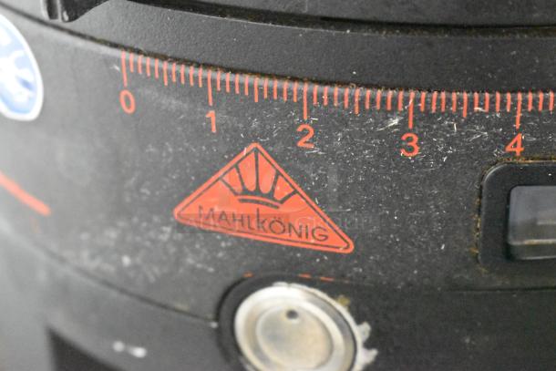 Mahlkonig Peak metal espresso grinder base, 120V, 1 phase, shows red Mahlkonig logo and grind settings, moderate wear visible.
