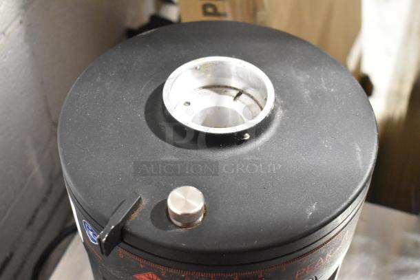 Mahlkonig Peak metal espresso grinder base, no hopper, 120V, used condition, commercial countertop design.