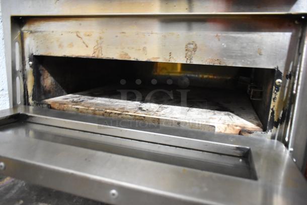 Avantco 177DPO18DD stainless steel double deck oven, used condition, open chamber view, independent controls, 240V, 1 Phase.