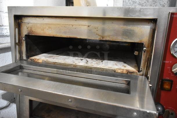 Avantco 177DPO18DD stainless steel double deck countertop pizza oven, showing open chamber, visible wear. 240V, 1 Phase.