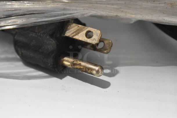 Close-up of the electrical plug for the Avantco 360CFM3 Metal Mini Cooler Merchandiser. Plug is slightly worn.