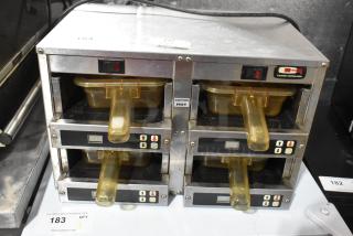 Carter Hoffmann MC2W2S stainless steel heated merchandiser, 120V, 1 phase, four compartments, "Caution Hot" label.